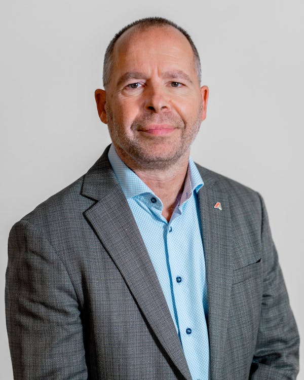 Professional portrait of Claus Hansen from ServiceNow partner Adeno.