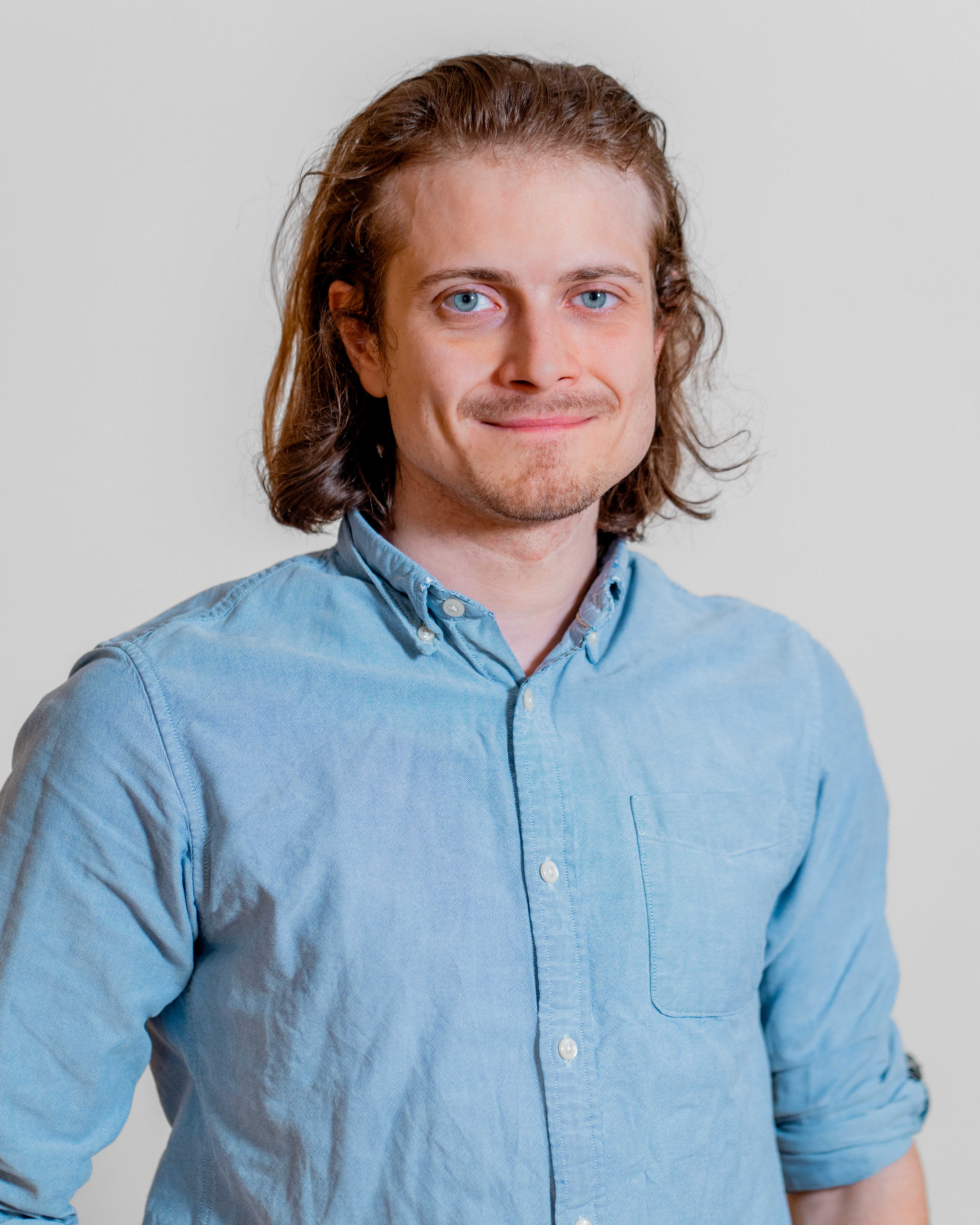 Portrait of Jan Winther, a ServiceNow professional, wearing a light blue button-down shirt.