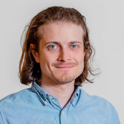 Portrait of Jan Winther, a ServiceNow professional, wearing a light blue button-down shirt.