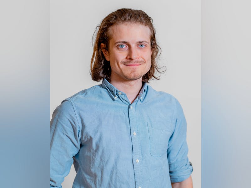 Portrait of Jan Winther, a ServiceNow professional, wearing a light blue button-down shirt.