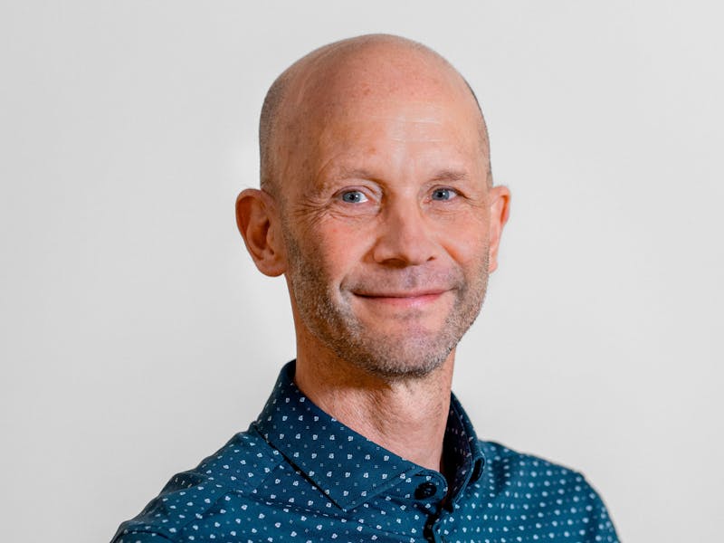 Portrait of Martin Green, a ServiceNow professional, wearing a blue patterned shirt.