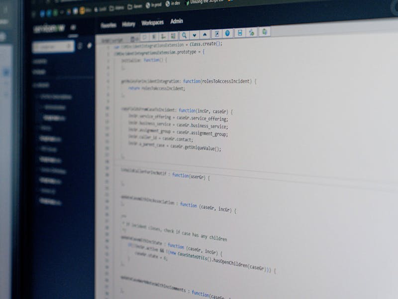 A computer screen displaying code within the ServiceNow platform interface.