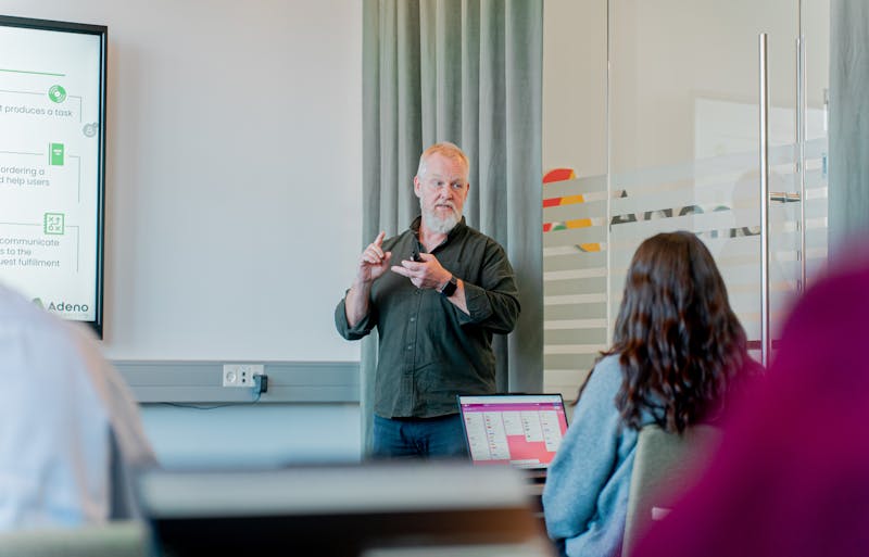 A man with a white beard presenting a ServiceNow training session.