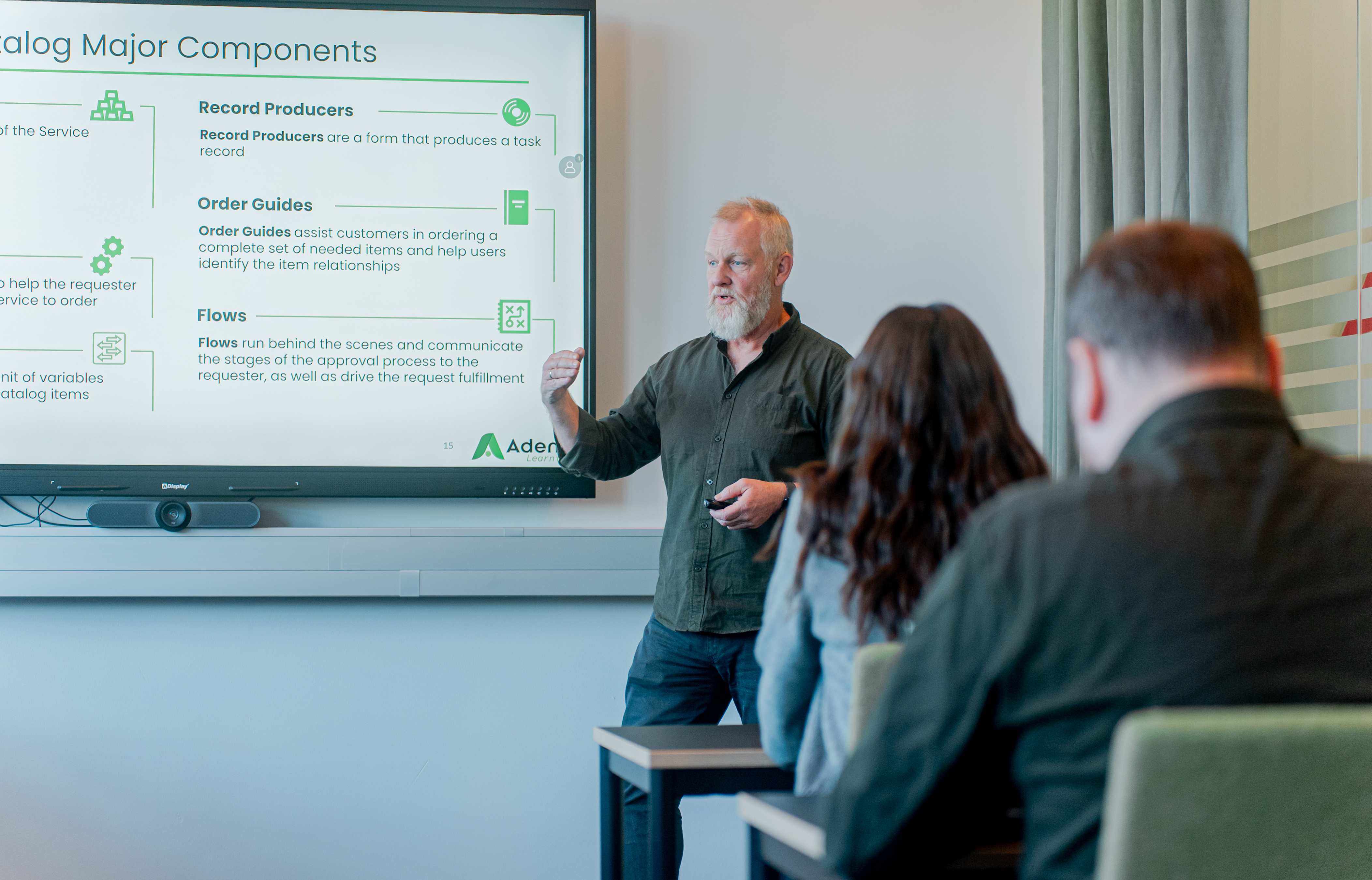 A man giving a presentation about ServiceNow Catalog Major Components to an audience.