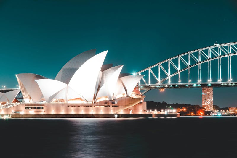 Night view of the Sydney Opera House and Sydney Harbour Bridge for the ServiceNow Australia Release.