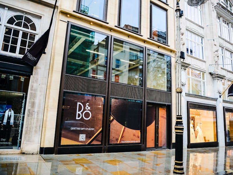 Street-level view of a Bang & Olufsen storefront with window displays and the B&O logo, relevant to ServiceNow.