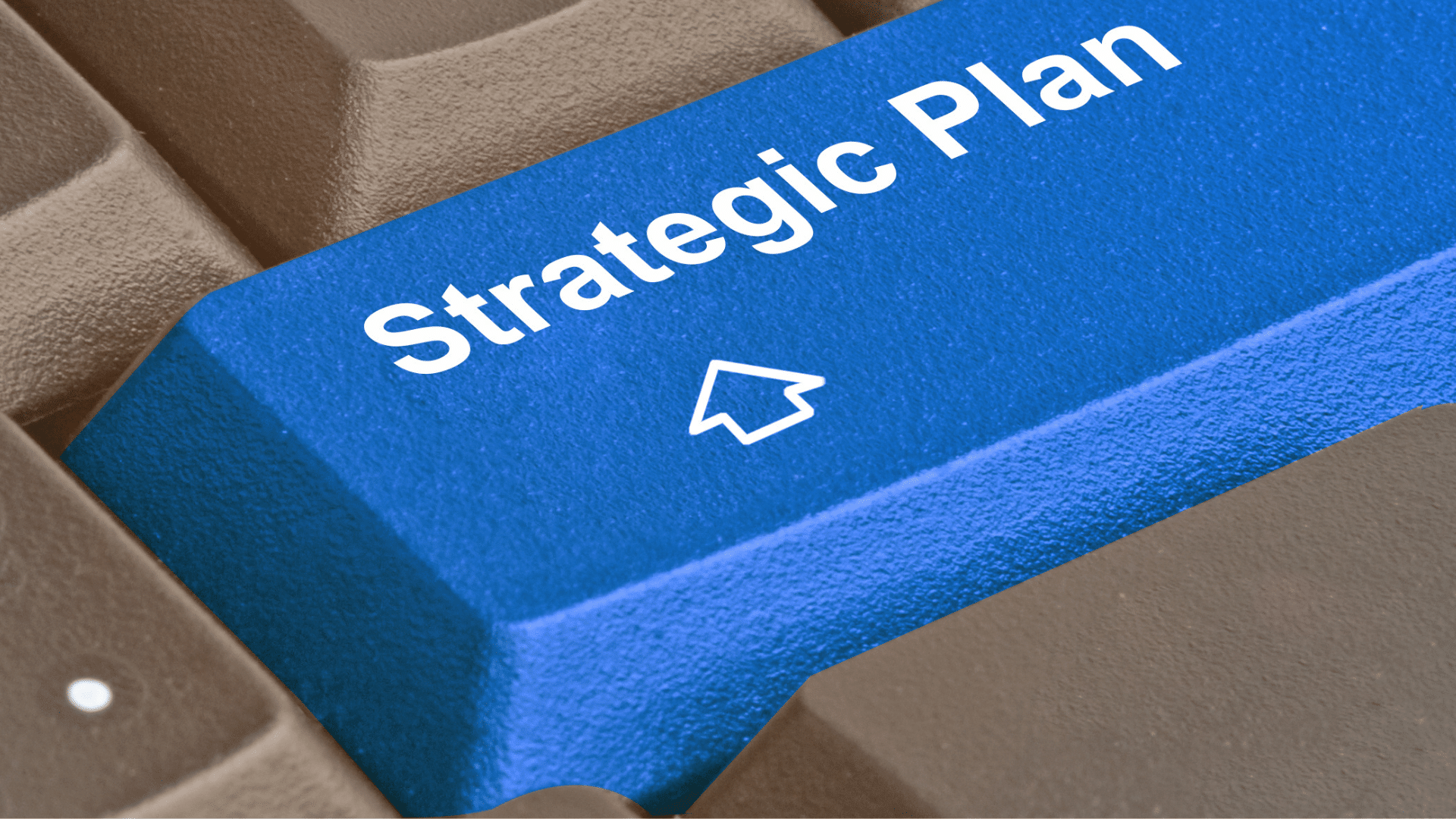 A blue keyboard key with the text 'Strategic Plan' and an upward arrow icon for a ServiceNow strategic plan.