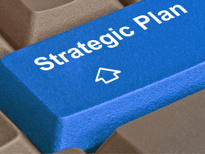 A blue keyboard key with the text 'Strategic Plan' and an upward arrow icon for a ServiceNow strategic plan.