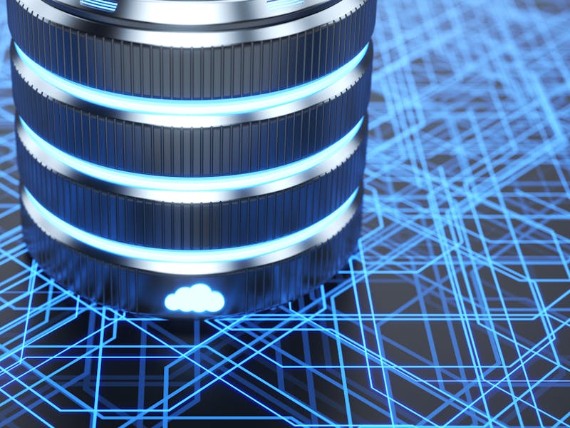 A metallic server cylinder with glowing blue rings and a cloud icon on a digital circuit background, representing ServiceNow.