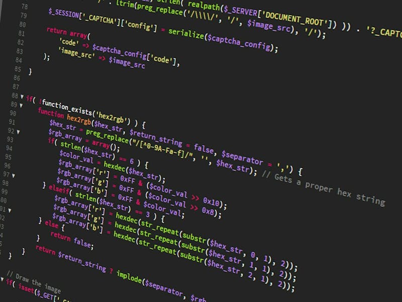 Close-up of computer code on a dark screen for a ServiceNow scripting governance tool.