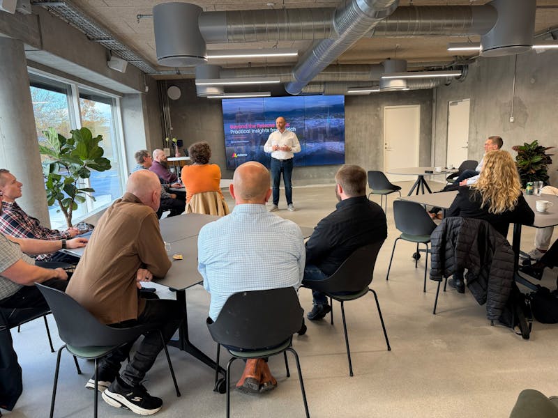 A presenter speaks to an audience during a ServiceNow Zurich release event.