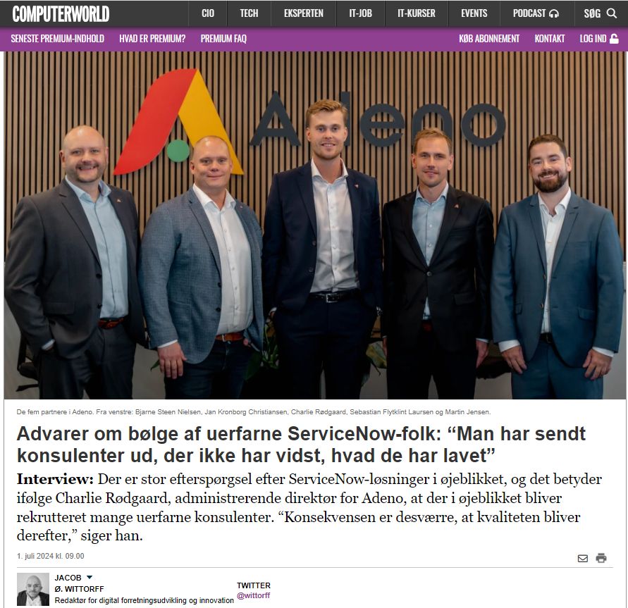 Five partners from Adeno, a ServiceNow partner, standing in front of the company logo.