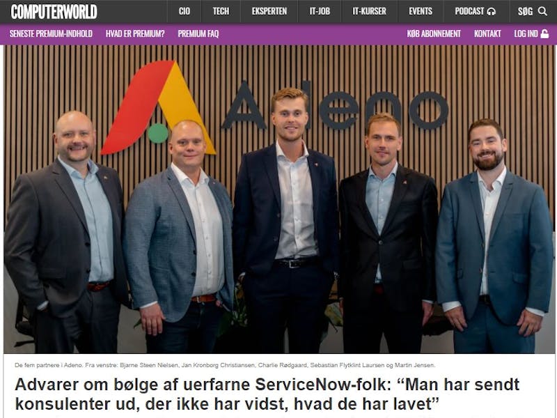 Five partners from Adeno, a ServiceNow partner, standing in front of the company logo.