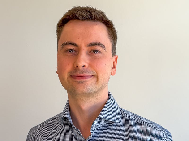 Portrait of Frederik Viuf Christiansen, a ServiceNow professional, wearing a blue and white striped shirt.