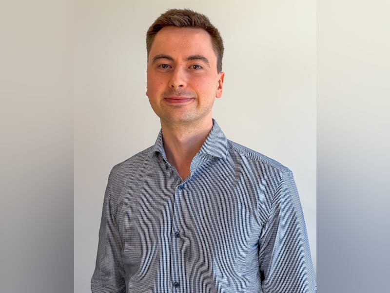 Portrait of Frederik Viuf Christiansen, a ServiceNow professional, wearing a blue and white striped shirt.