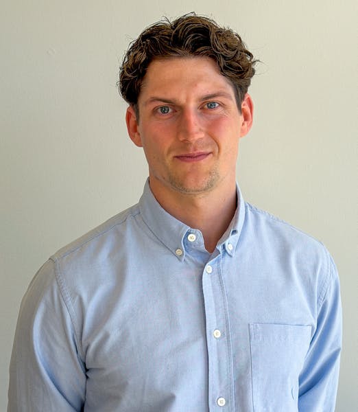 Portrait of Martin Krabbe Nielsen, a ServiceNow professional, wearing a light blue button-down shirt.