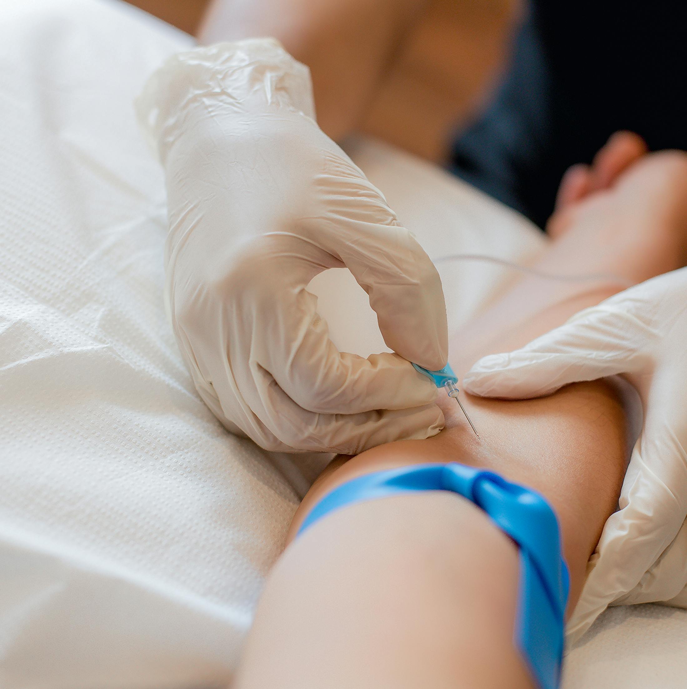 woman getting an IV inserted