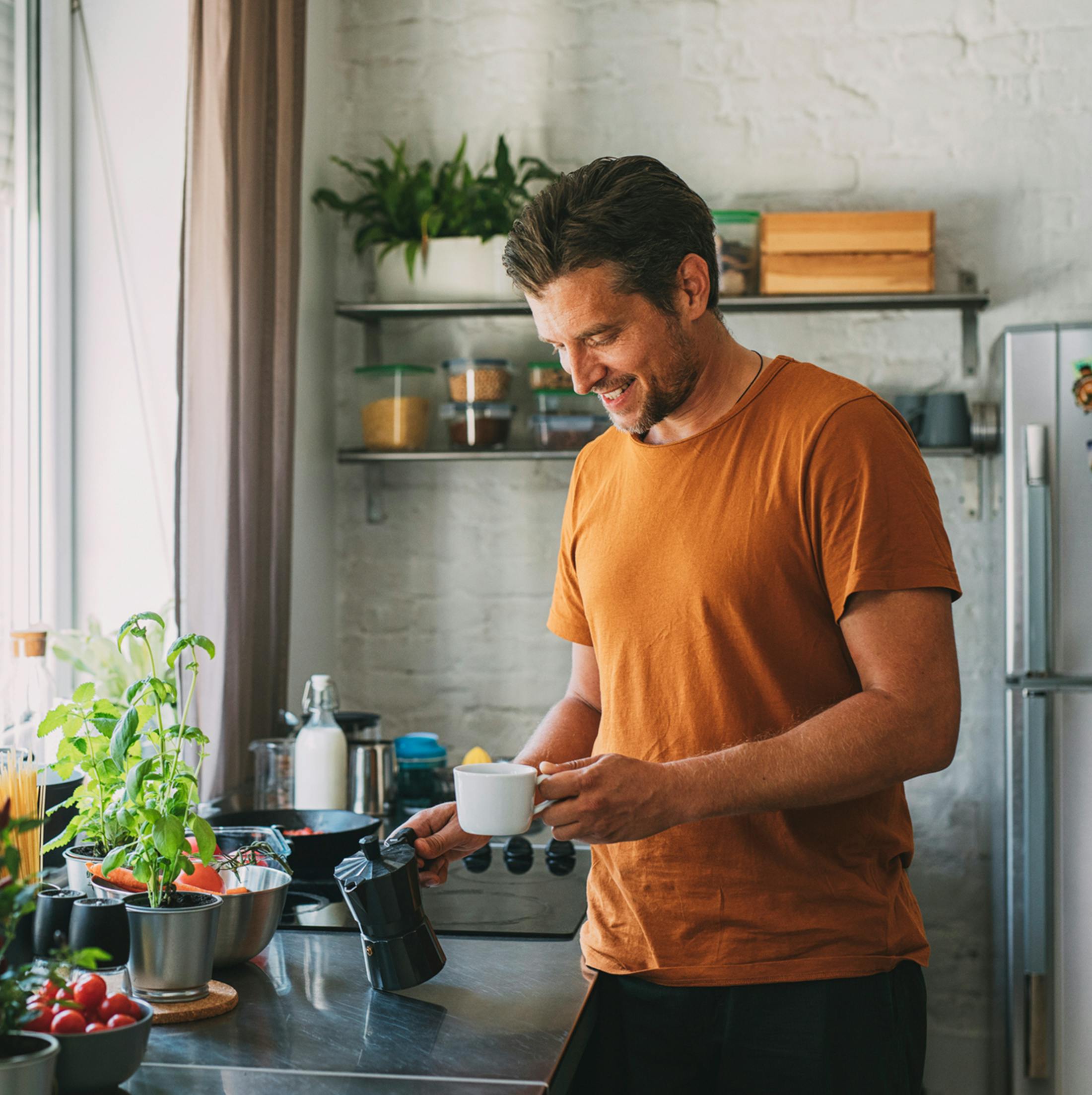 man holding a cup of coffee
