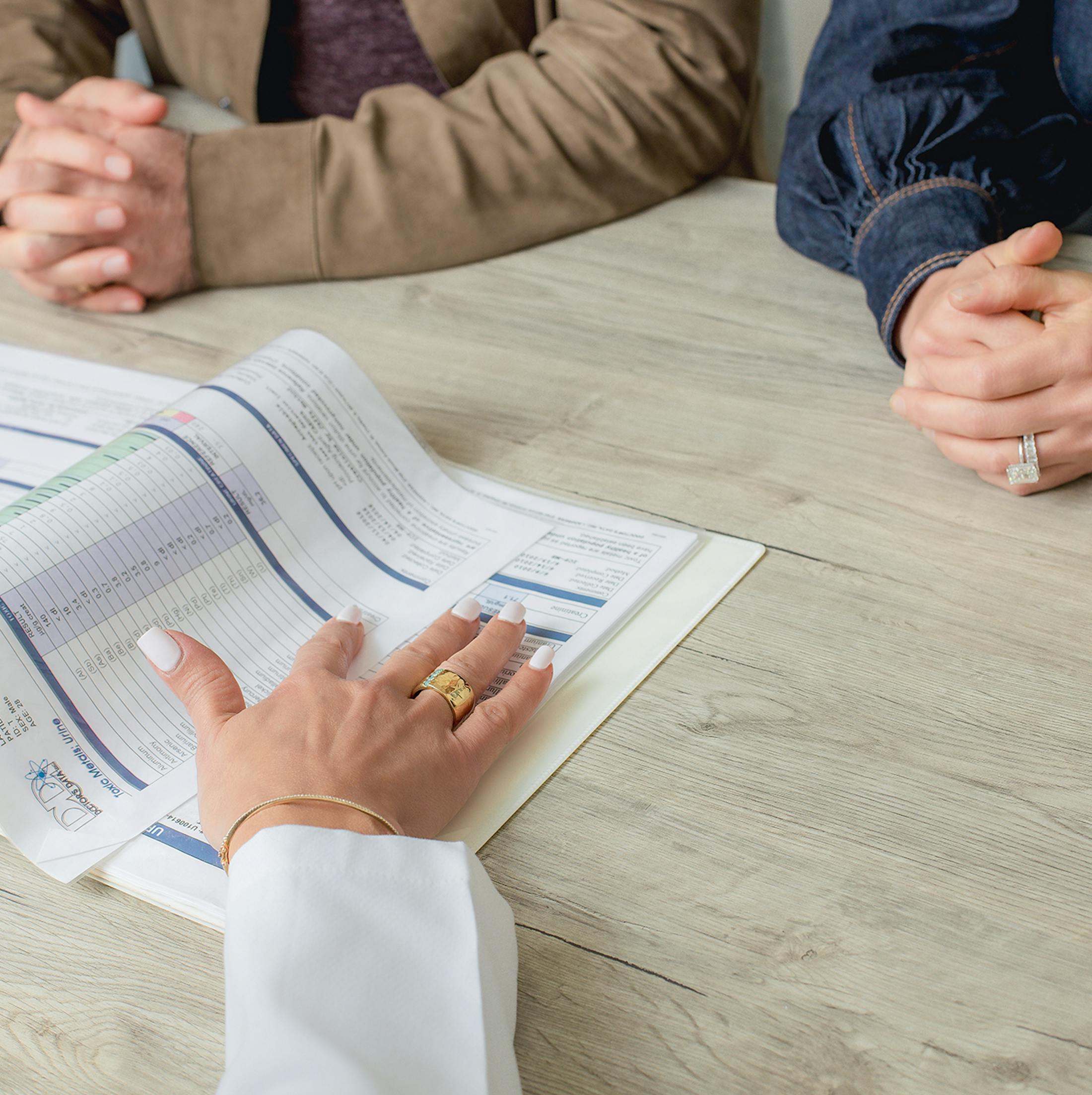 Doctor and patient going through paperwork
