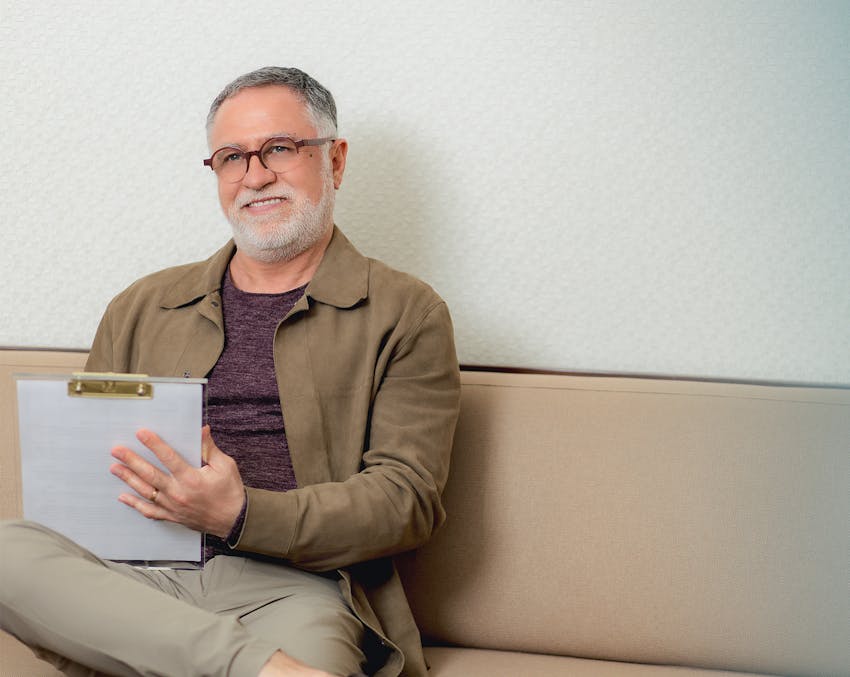 man filling out paperwork