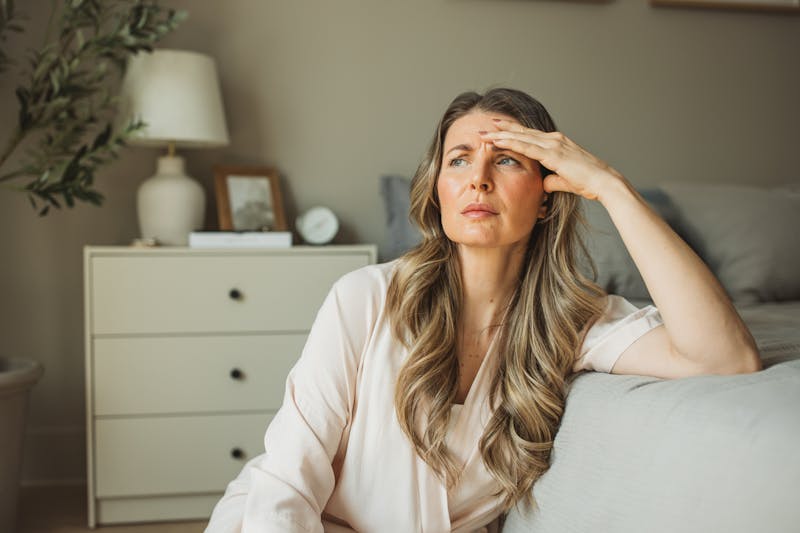 tired woman in bedroom