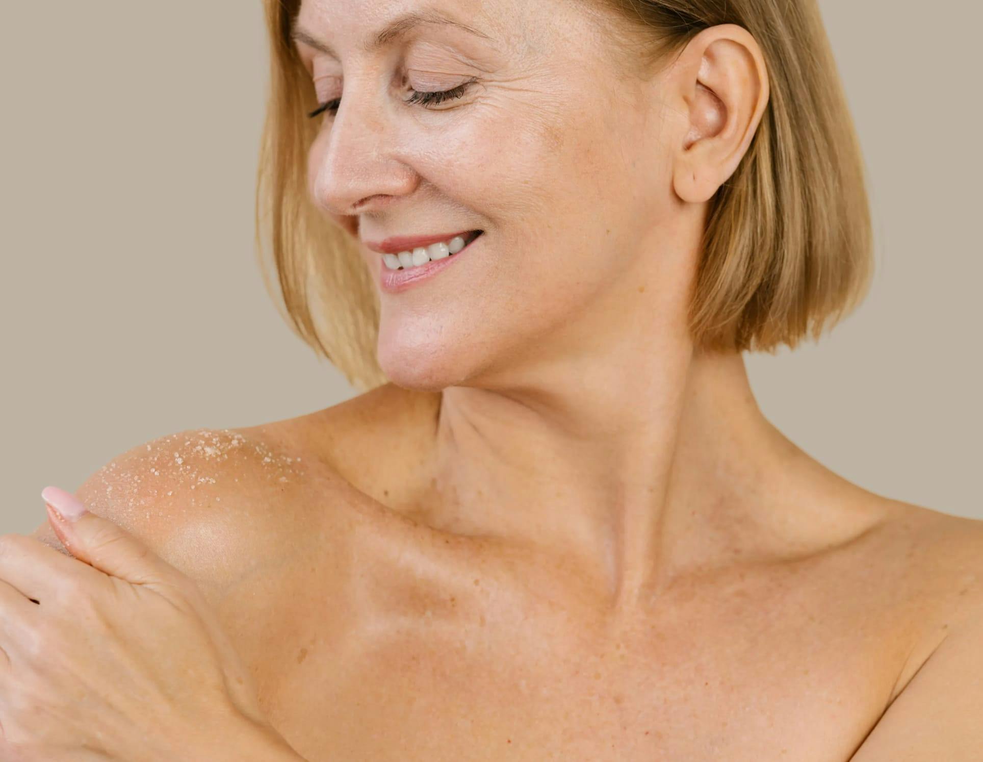 A woman touching her shoulder