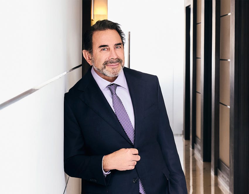 Dr. Nassif leaning against a wall