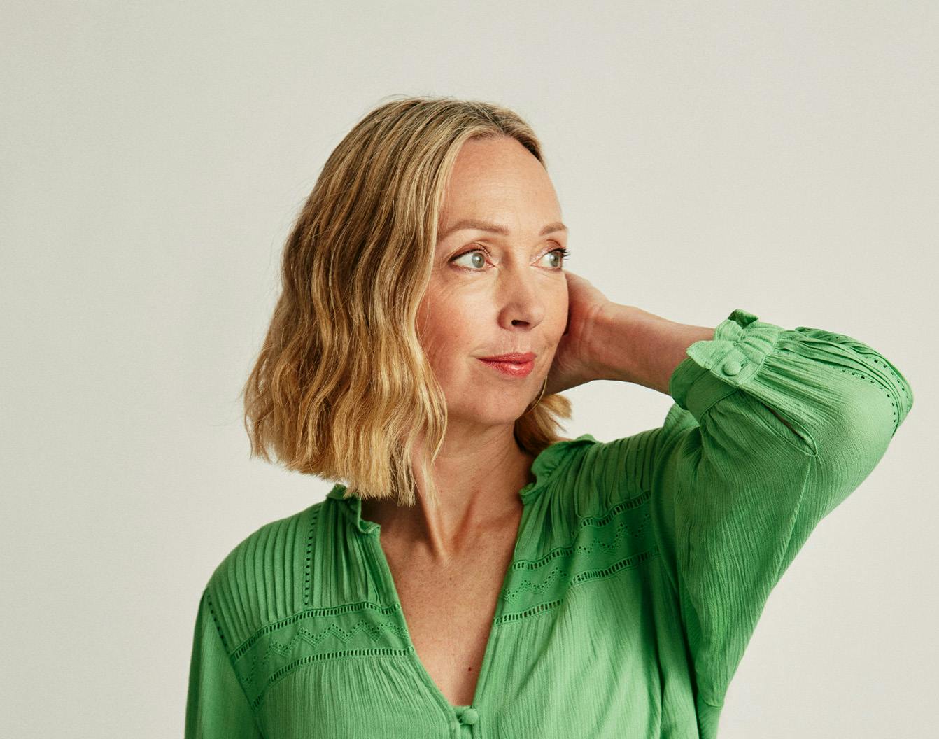 A woman touching her hair