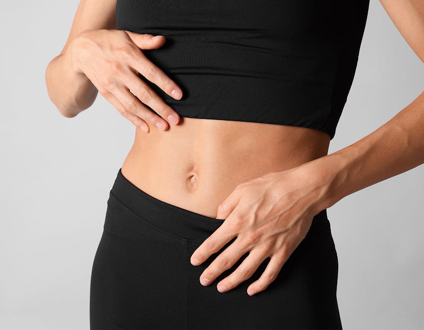 woman touching her stomach