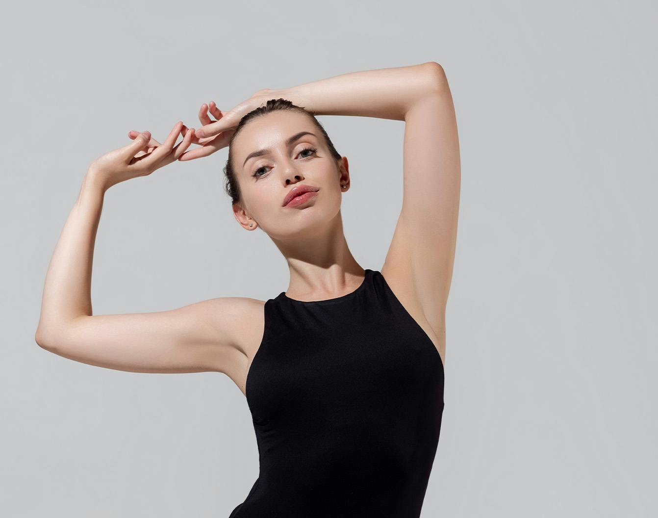 woman with her arms above her head