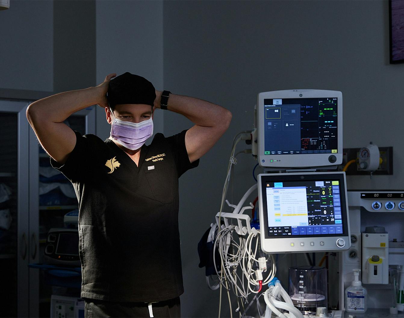 doctor tying on his cap