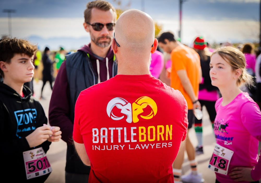 BattleBorn Injury Lawyers talking to other runners at the Rockin' Reindeer Race