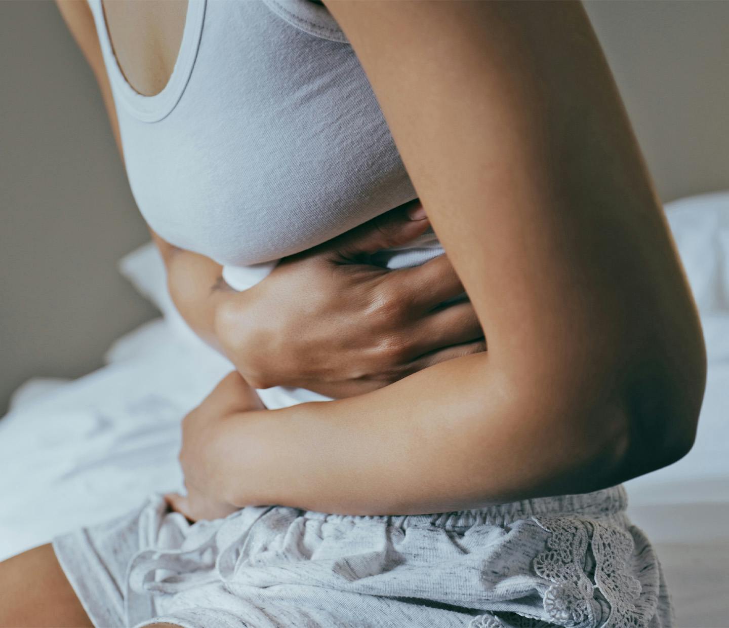 Woman holding her stomach in pain