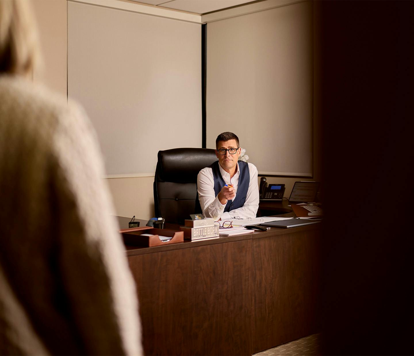 man sitting at desk