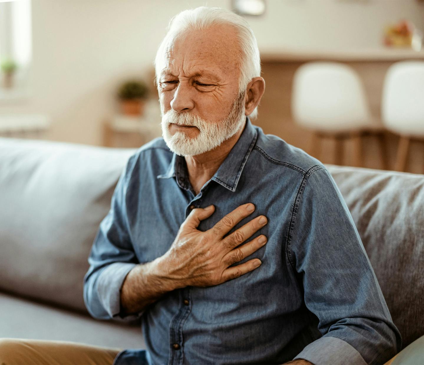 older man having chest pain