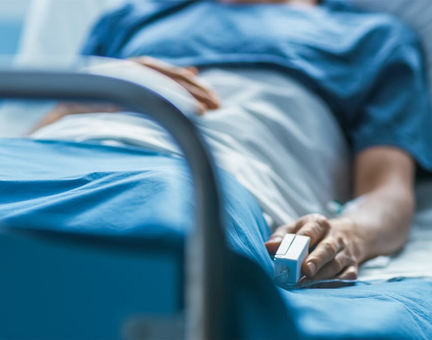 person laying in hospital bed