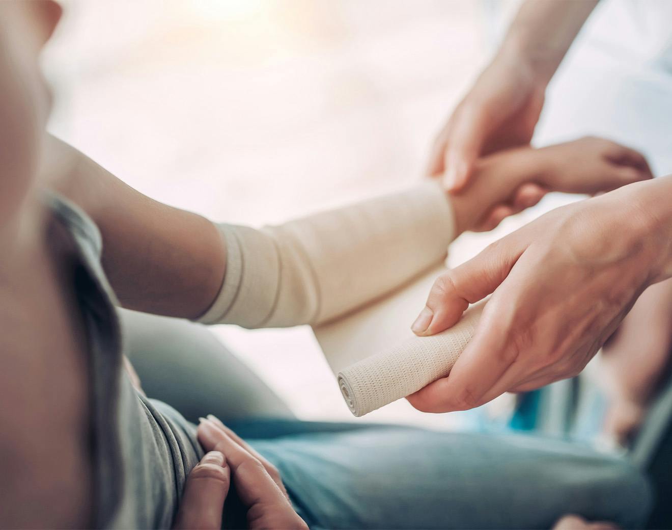 doctor wrapping child's arm