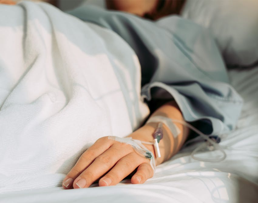 person in hospital bed