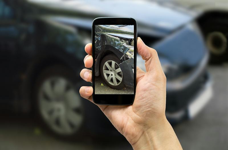 person taking photo with phone