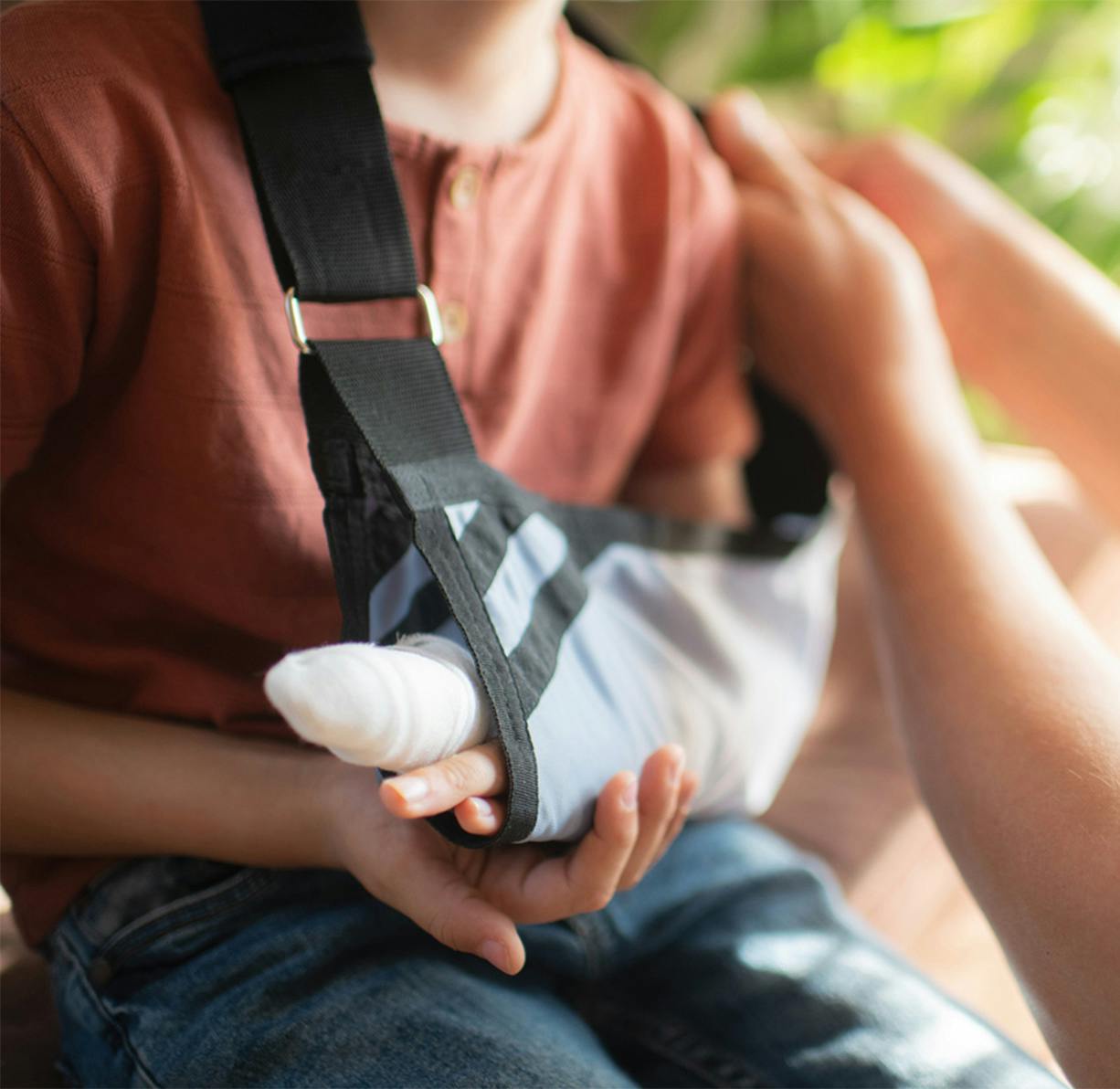 A child with a hurt arm
