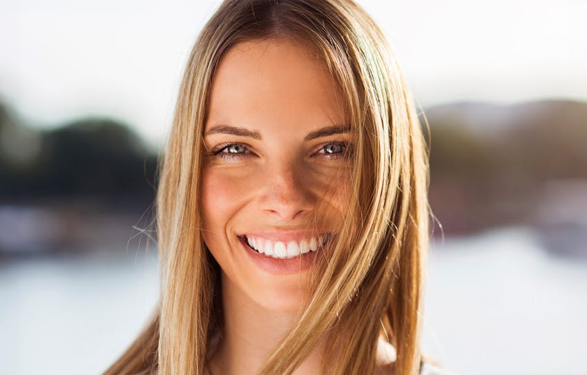 close up of womans face smiling