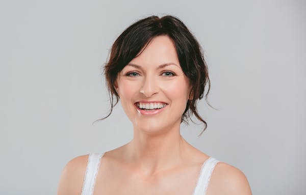 woman smiling looking at camera