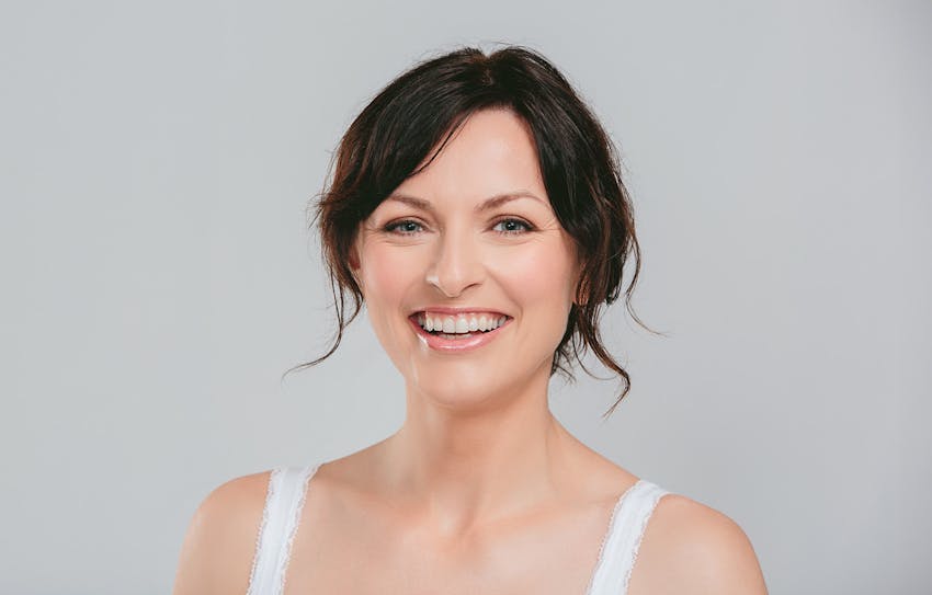 woman smiling looking at camera