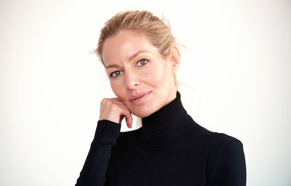 woman with hand on face