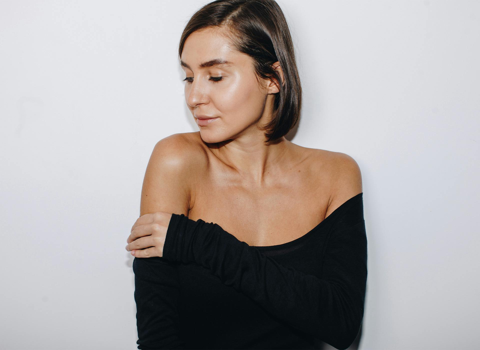 woman touching shoulder