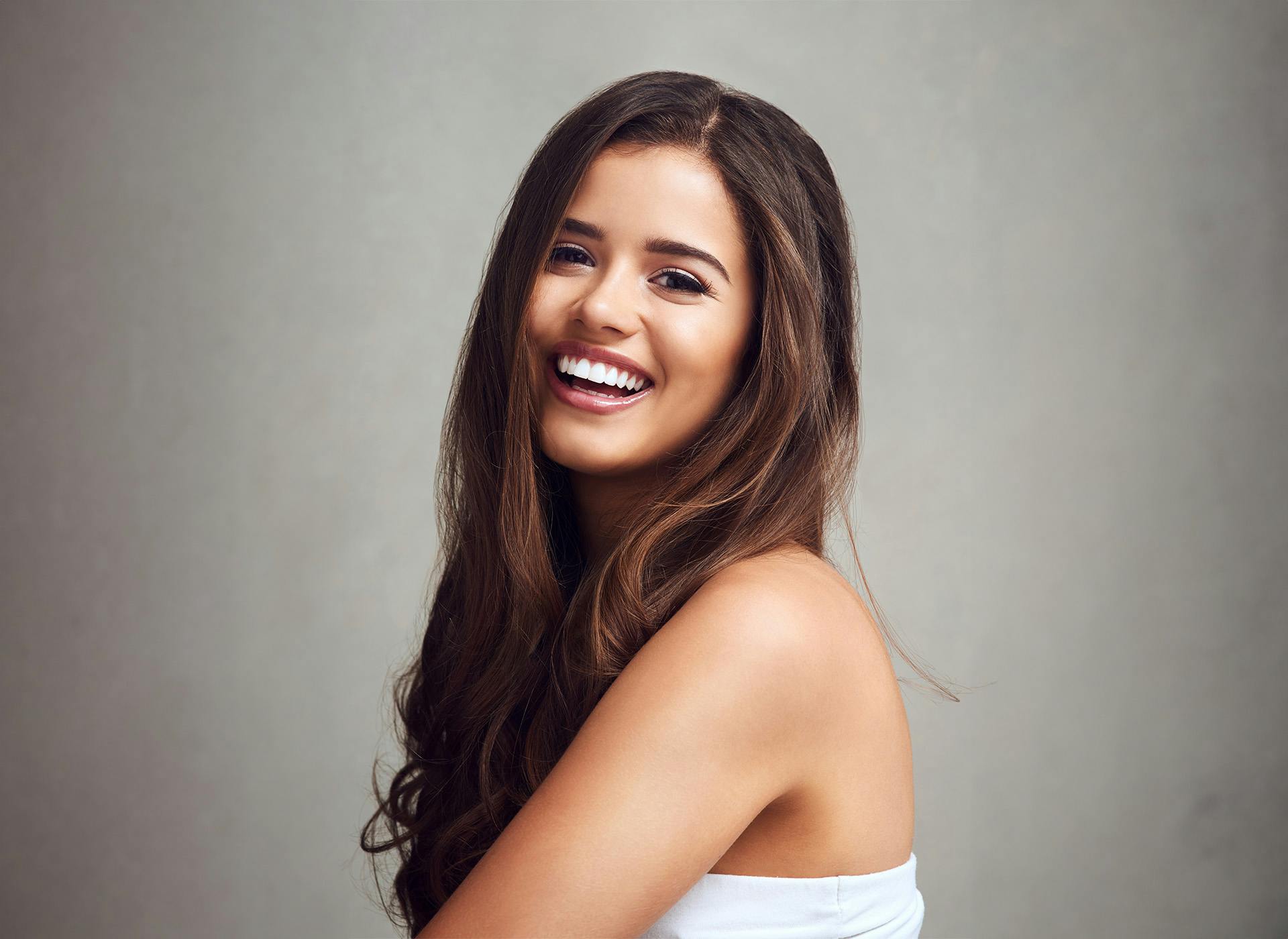 woman smiling looking over shoulder