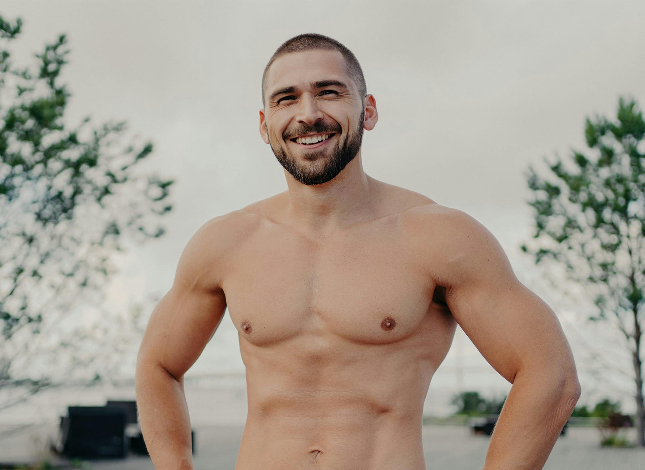 smiling shirtless man