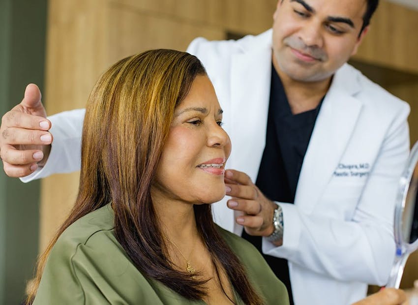 Dr. Chopra about to point to patient's jaw