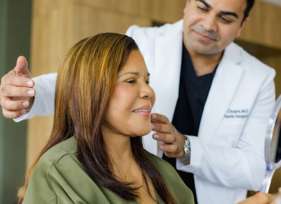 Dr. Chopra about to point to patient's jaw