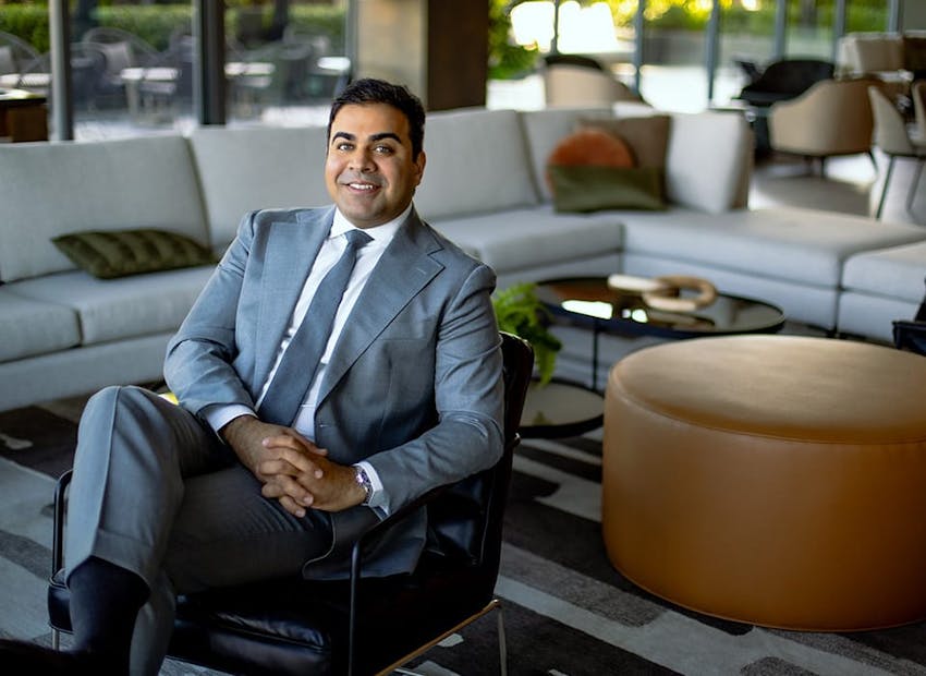 Dr. Chopra sitting in chair in waiting room